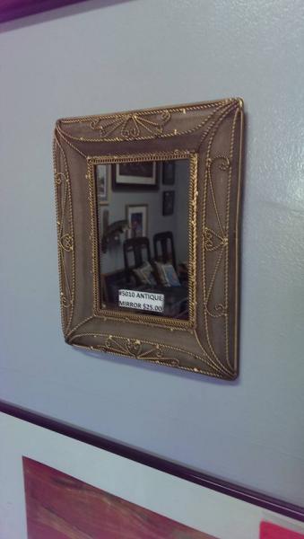 Take a look at this intricate gold mirror! 